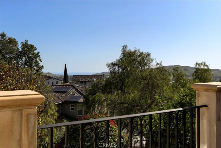 A hint of ocean view from the second level primary bedroom balcony