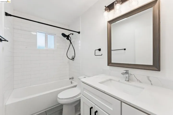 Bathroom featuring vanity and tub / shower combination