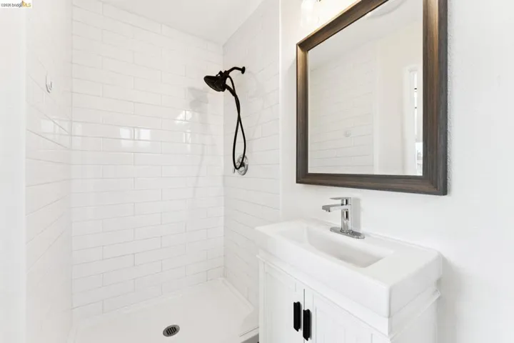 Bathroom with vanity and a stall shower