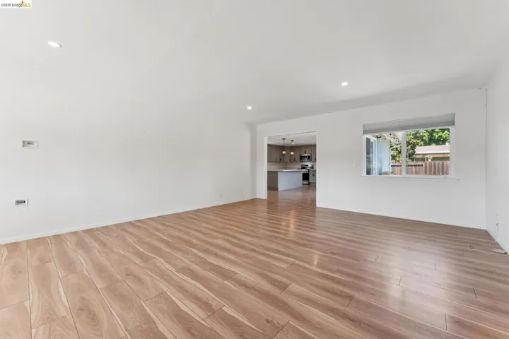 Unfurnished room with light wood-type flooring and recessed lighting