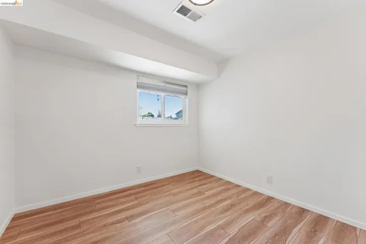 Empty room featuring light wood-style floors