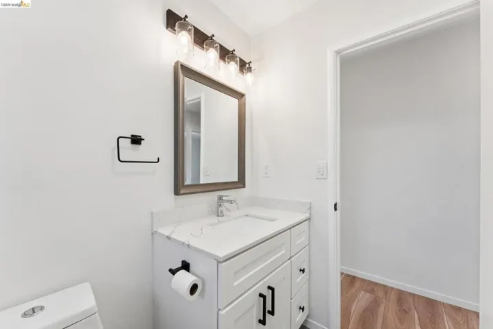 Bathroom with vanity and light wood-type flooring