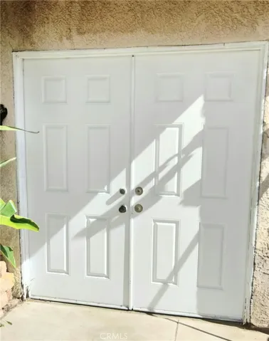 Double door from garage to backyard.