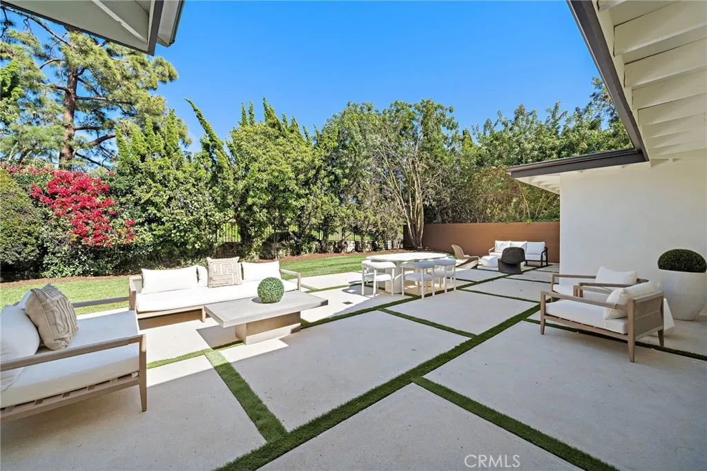 Private backyard retreat with custom paver layout