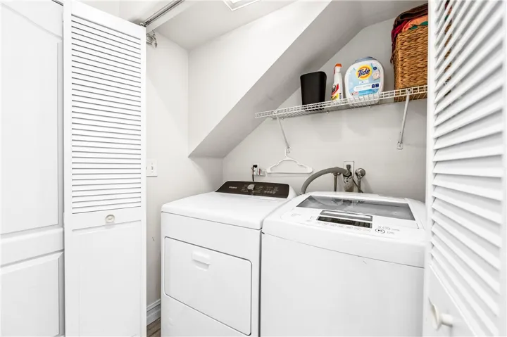 Designated laundry area in the hallway.