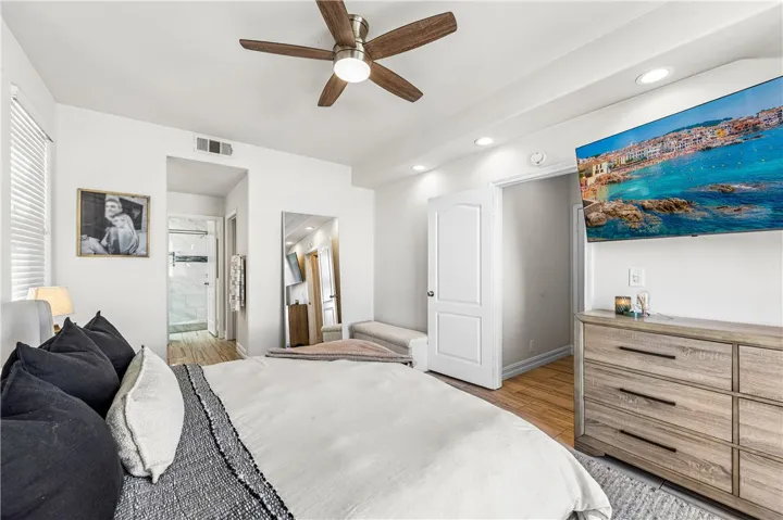 View looking towards the ensuite, walk-in closet to the right, vanity area on the left, leading to large remodeled walk-in shower.