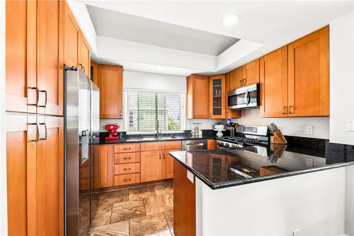 Kitchen area open to the main living area. Perfect for entertaining or quiet nights at home.