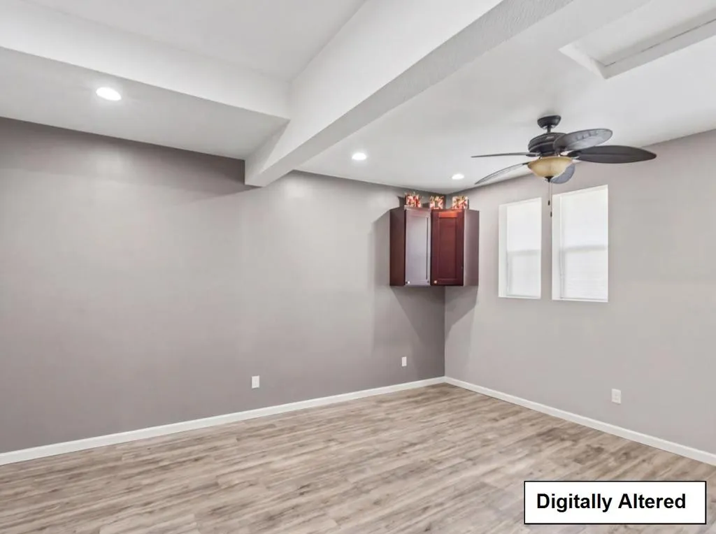 DIGITALLY ALTERED- DECLUTTERED TO SHOW POTENTIAL OF OFFICE IN GARAGE