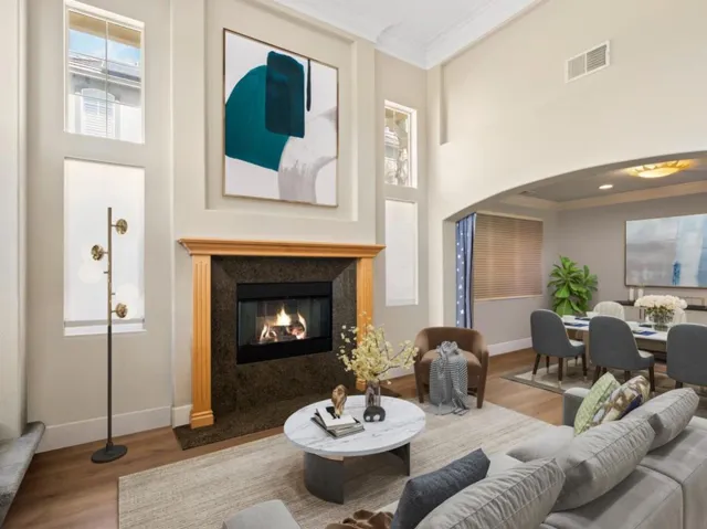 This is digitally staged to show you living room and formal dining room
