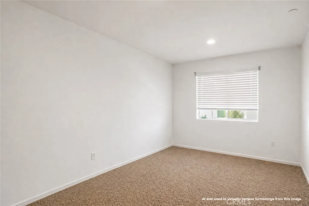 AI was used to virtually remove furnishings from this image.