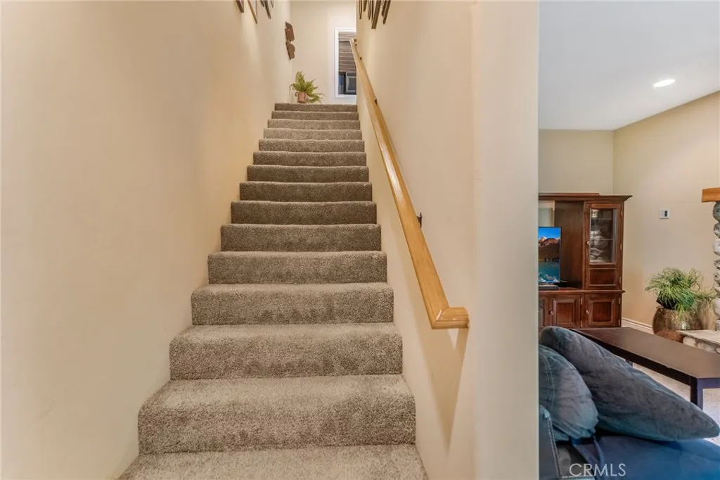 Stairs to bottom floor from main level living area.