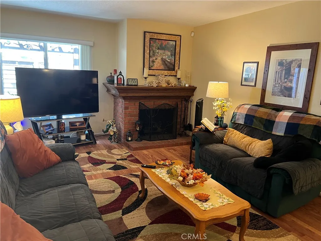 Gorgeous fireplace w/oak mantle & burns wood or gas