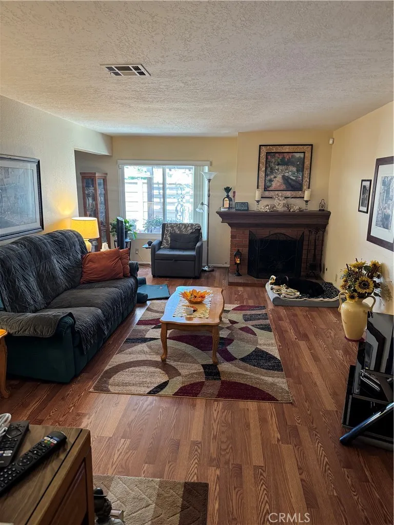 Spacious living room w/view to patio
