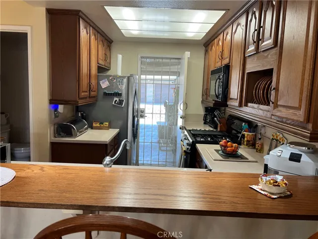 Counter top you can sit at looking thru kitchen to garage