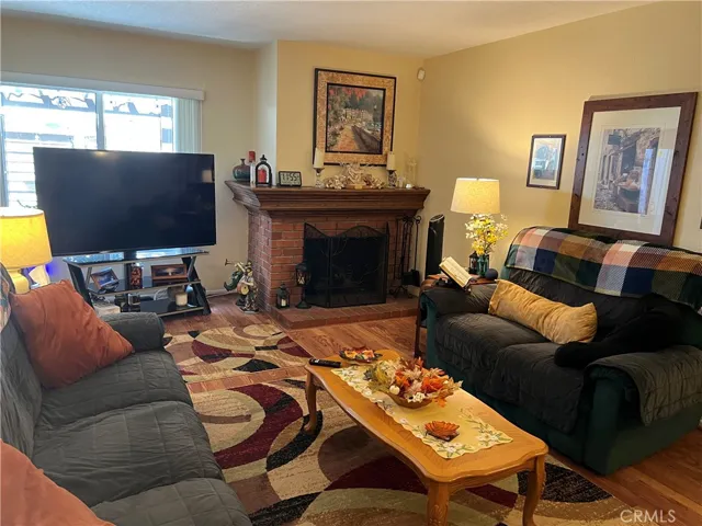 Gorgeous fireplace w/oak mantle & burns wood or gas