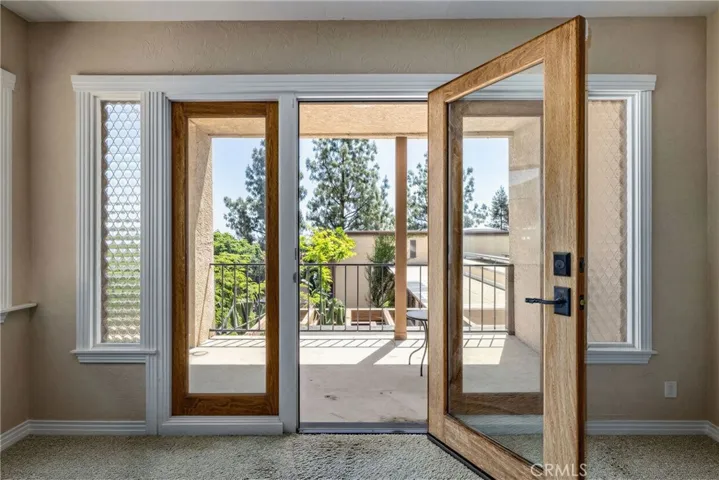 Primary Bedroom #1 with French Doors and Mid Century Glass Panels