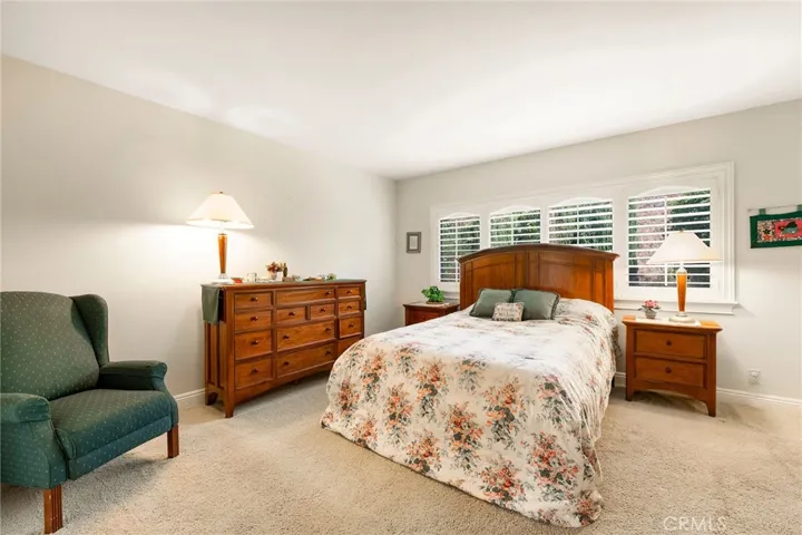 Owner's suite is enhanced with plantation shutters.