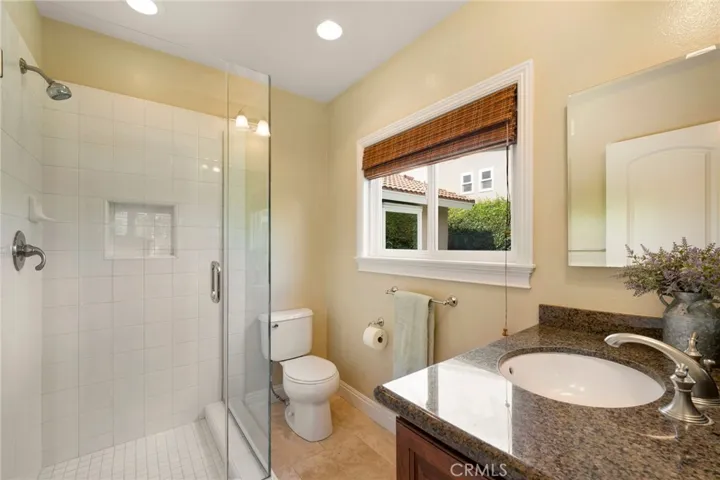 Owner's suite bath offers a step in shower.