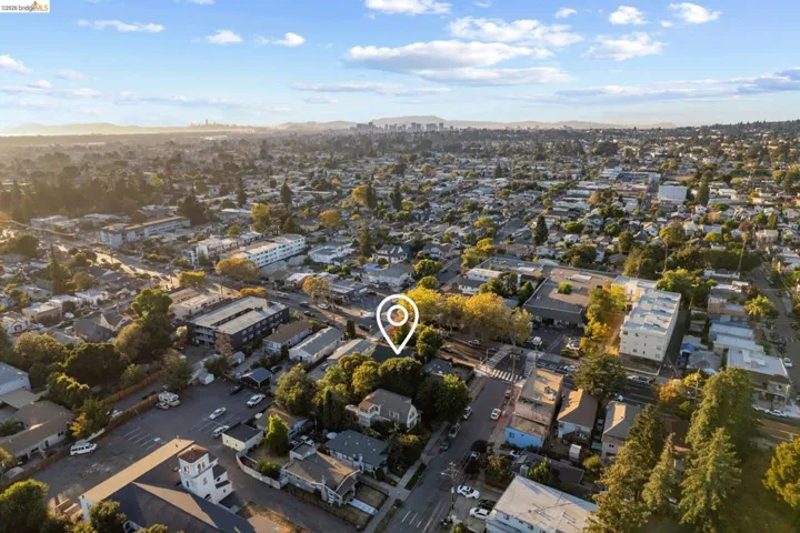 Aerial perspective of a verdant urban landscape with diverse residential and commercial structures