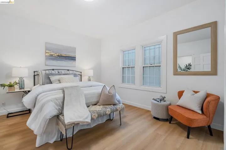 Bright interior featuring light wood-finish flooring and white walls