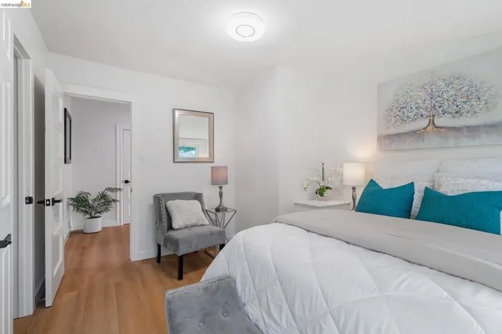 Bright interior featuring light wood-finish flooring, white walls, and white trim