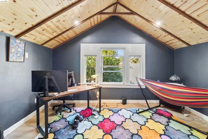 Vaulted wood-paneled ceiling with exposed beams