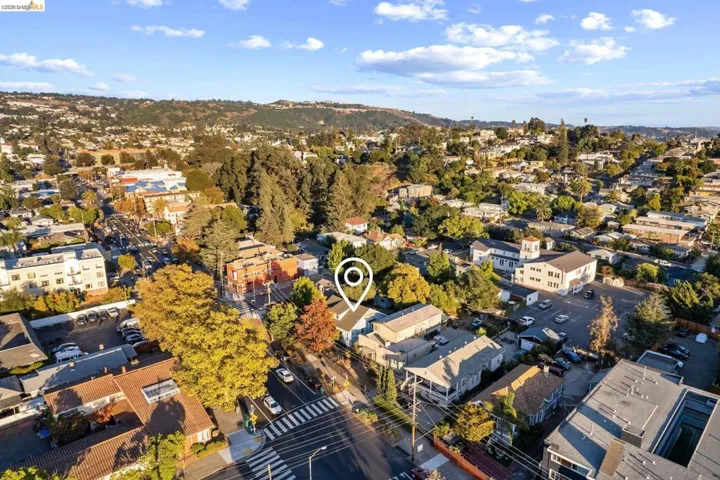 Aerial perspective showcasing a residential and commercial area with varied building styles