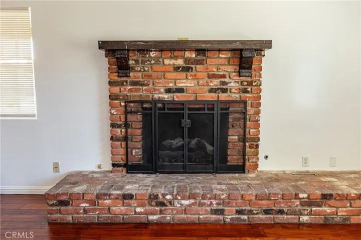 Exposed brick fireplace in the Living Room.