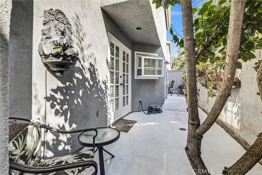 Reverse View of Back Patio area - looking toward small patio table and chairs corner