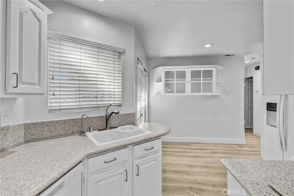 Kitchen with Good Cabinet space - Counter depth Frig, Stove Top cooking with Gas, Dishwasher and Microwave neatly compact. Another set of Double Doors for Outdoor access or a well place kitchen eating area.