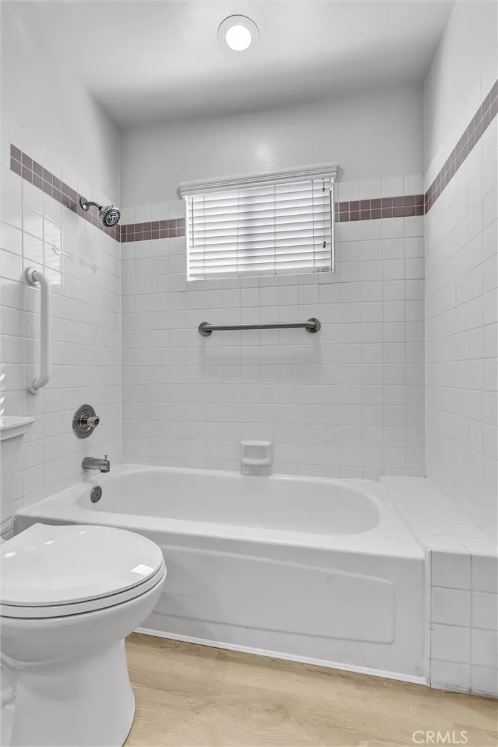 Closeup shot Tub area and new American Standard Commode