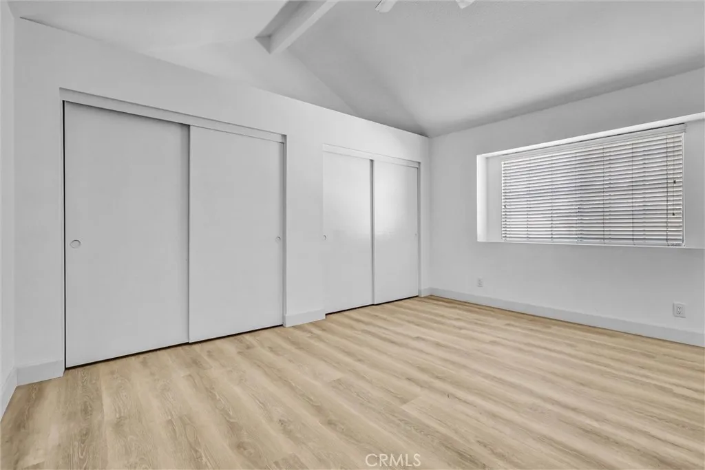 Main Bedroom with an entire wall of Closet storage as well as large space above the closets - large window for ample lighting as well.