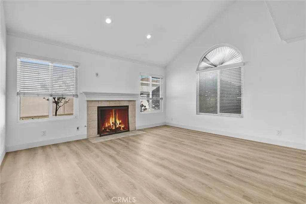Living Room straight-on View of Fireplace - Vaulted Ceilings with LED lighting