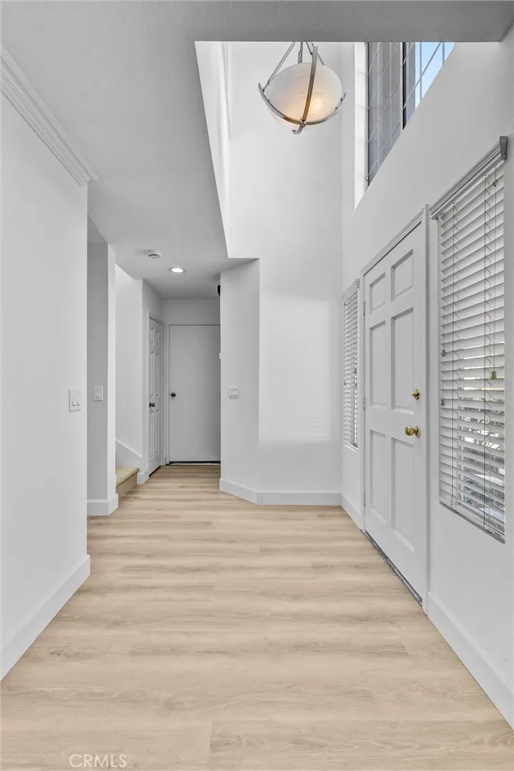 Front Entry looking toward Garage door access - 1/2 Bath on the right just before reaching the garage door