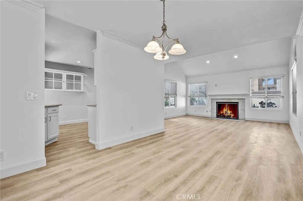 Back corner view of Dining Room area into Kitchen and Living Room - Great Natural Lighting