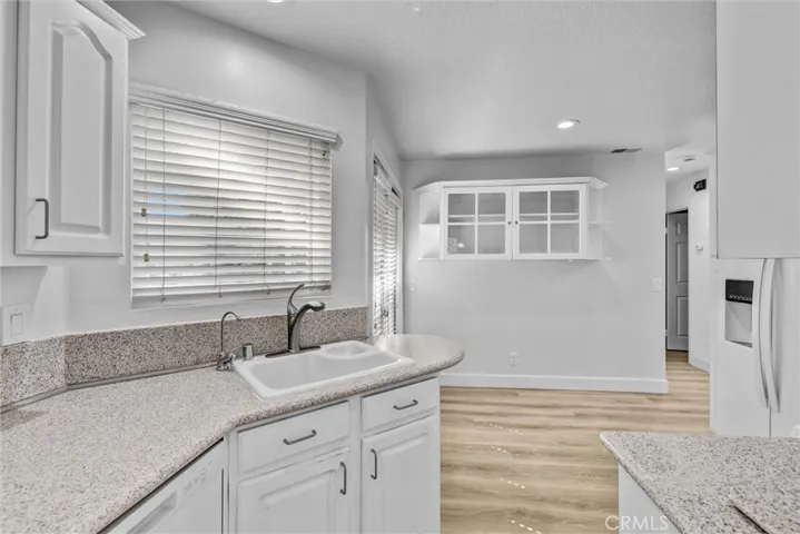 Kitchen with Good Cabinet space - Counter depth Frig, Stove Top cooking with Gas, Dishwasher and Microwave neatly compact. Another set of Double Doors for Outdoor access or a well place kitchen eating area.