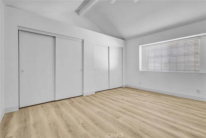 Main Bedroom with an entire wall of Closet storage as well as large space above the closets - large window for ample lighting as well.