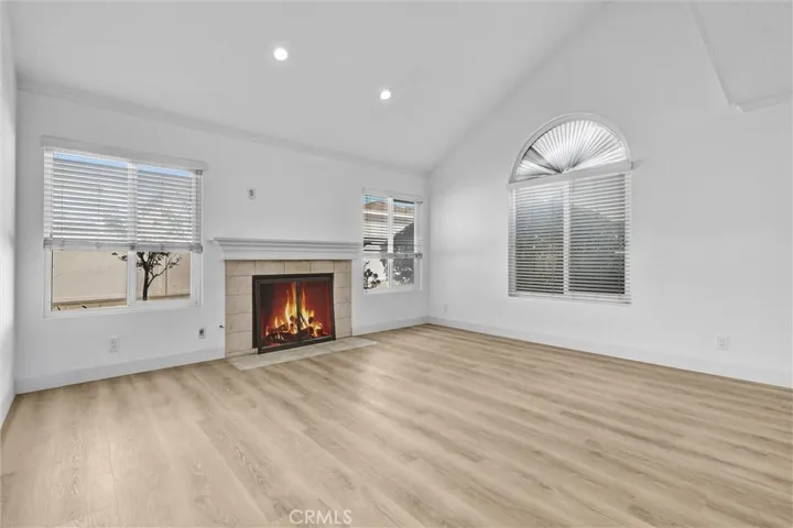 Living Room straight-on View of Fireplace - Vaulted Ceilings with LED lighting