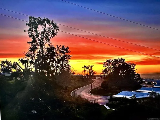 Stunning sunset view from the patio/backyard - dining room, kitchen.