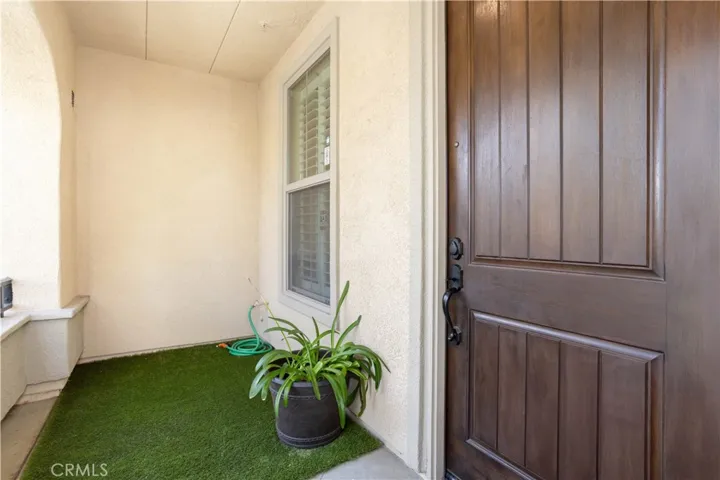 Charming Entryway Featuring a Private Enclosed Patio