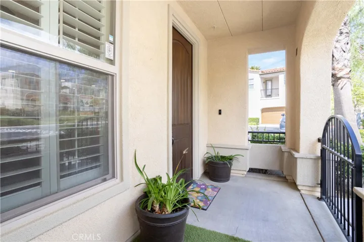Charming Entryway Featuring a Private Enclosed Patio