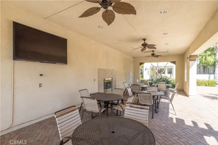 Resort-Style Community Seating Area with Fireplace and TV