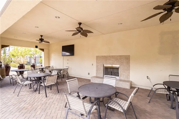 Resort-Style Community Seating Area with Fireplace and TV