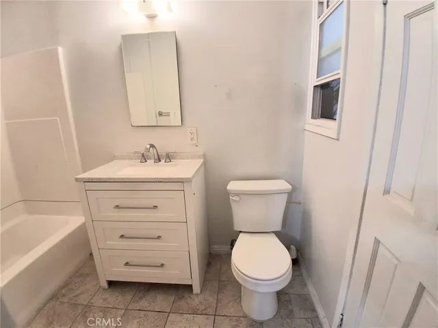 Oversized primary bathroom offering a spacious and comfortable retreat