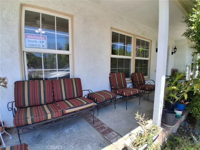 Relax and unwind on the charming front porch—perfect for enjoying sunny afternoons or cozy rainy days.
