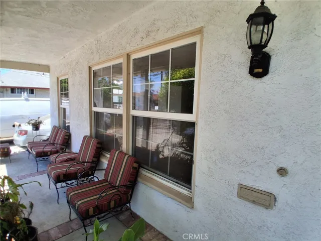 The welcoming front porch offers the perfect spot to relax with your morning coffee, rain or shine.