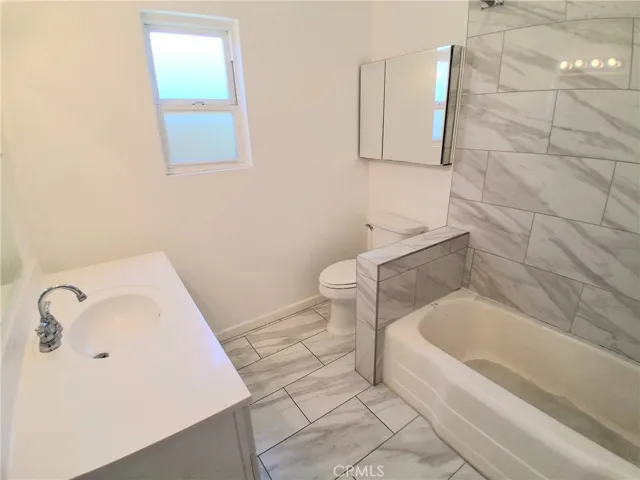 Bright and spacious bathroom filled with natural light.