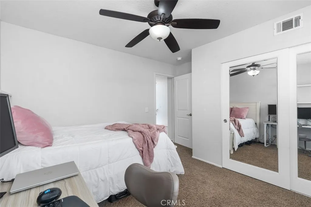 Bedroom 3 offering mirrored closets