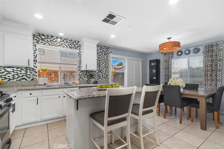 spacious kitchen with breakfast counter for quick meals