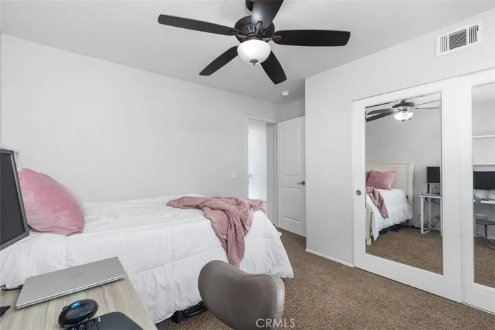 Bedroom 3 offering mirrored closets